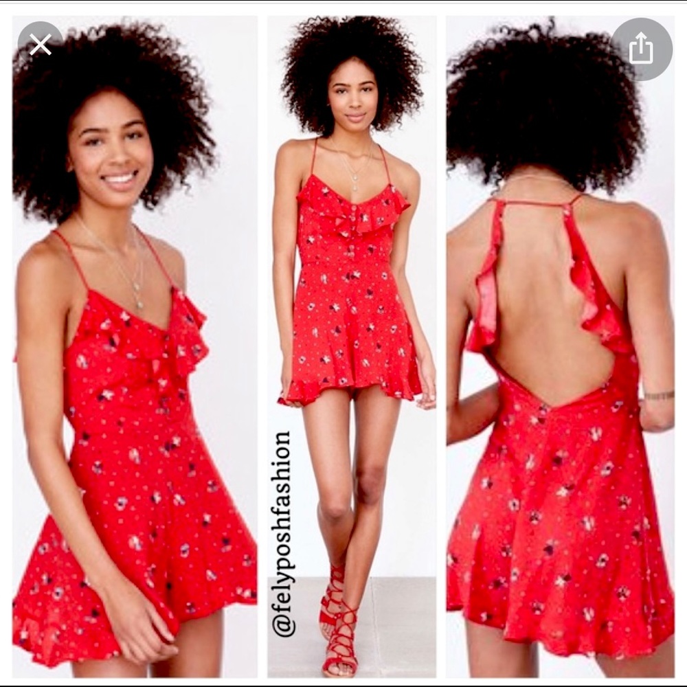 Flowy red romper with strappy back.